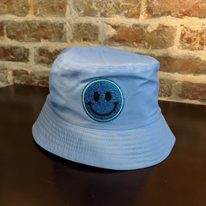 Powder Blue bucket hat with a sparkly smiley face