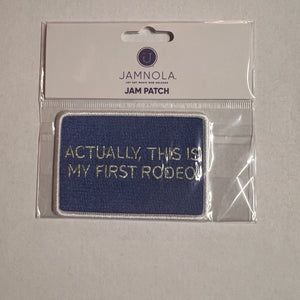 Blue patch with text 'Actually this is my first rodeo' on a clear packaging with Jannola branding.