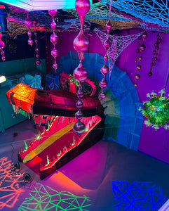 Alligator mouth open with bold glowing colored lights