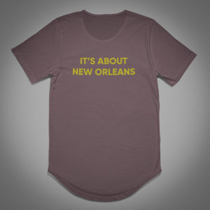 IT’S ABOUT NEW ORLEANS (Limited Ed Gold Metallic Curved Bottom Tee)