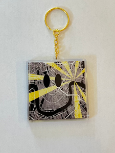 Acrylic Keychain of the riverbend in New Orleans with a smiley face on it