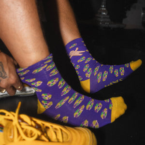 Purple kingcake socks with yellow toe and heel
