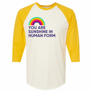 Yellow baseball tee that says You Are Sunshine in Human Form in purple print with a rainbow above.