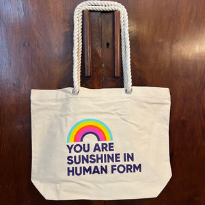 Canvas totebag with a rainbow and the quote You Are Sunshine in Human Form