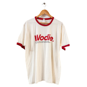 White t-shirt with red accents and 'Wodie' text on a hanger against a white background
