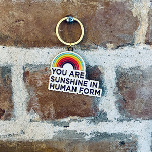 Enamel keychain with a rainbow and youare sunshine in human form